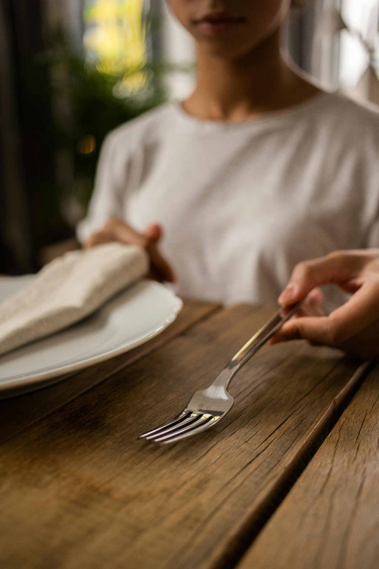 Warm cup of bone broth on a wooden table — bone broth and intermittent fasting