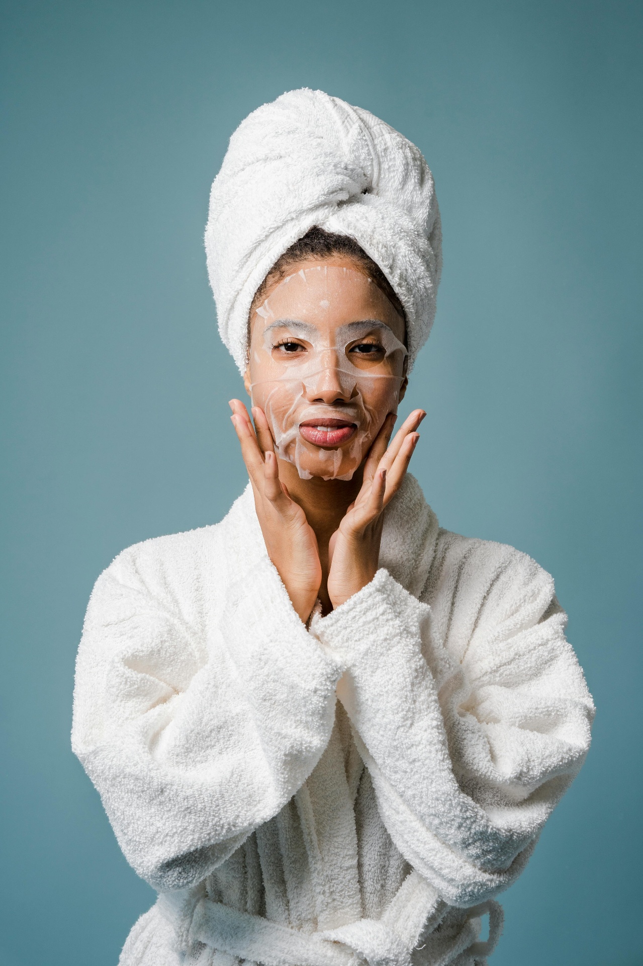 Woman in white robe and towel with skincare mask — bone broth vs collagen supplements for skin and beauty
